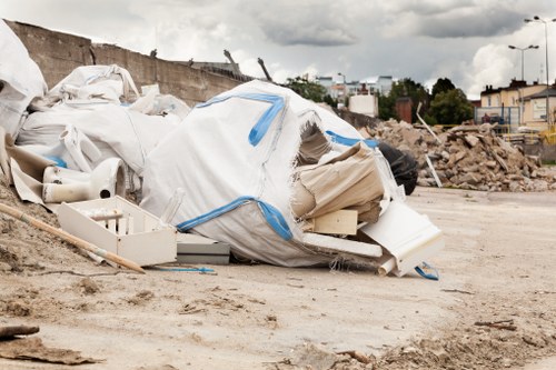 Construction site with builders removing waste debris
