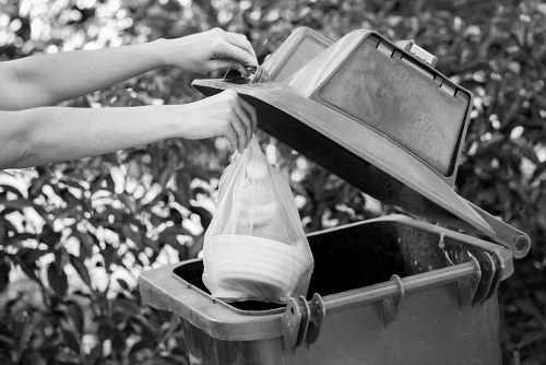 Homeowner preparing furniture for collection in Earls Court